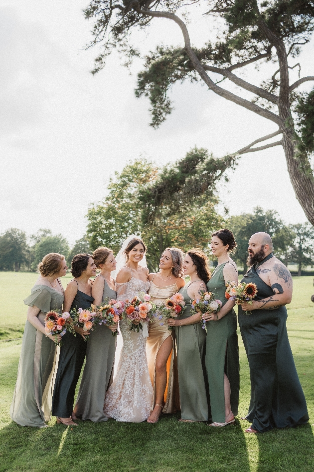 A group of bridesmaids wearing dresses