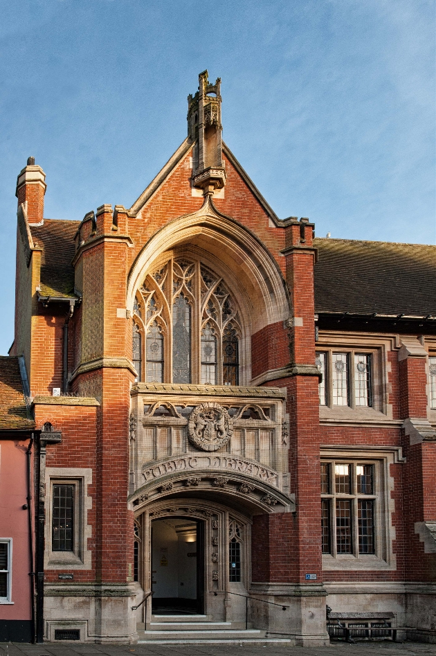 The exterior of a red brick and stone building