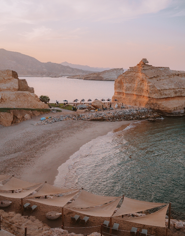 beach in desert setting with cliffs and sea