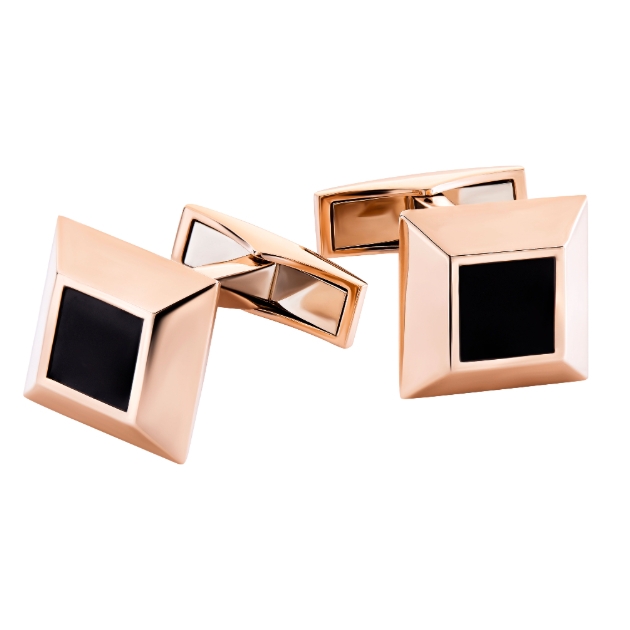 A pair of rose gold and black cufflinks